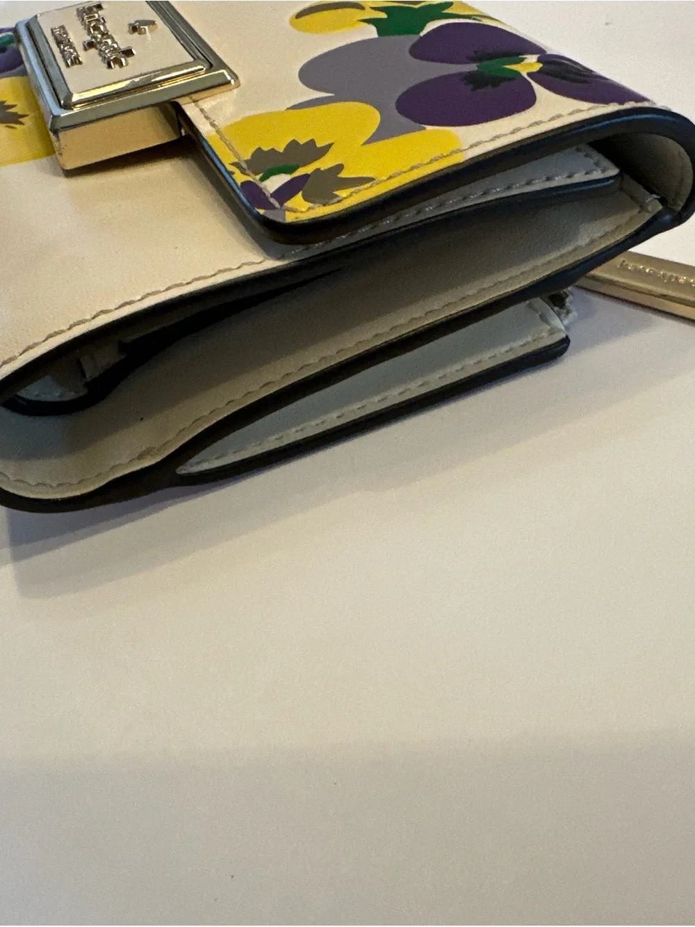 Kate Spade New York Reegan Pansy cream wallet with purple and yellow floral